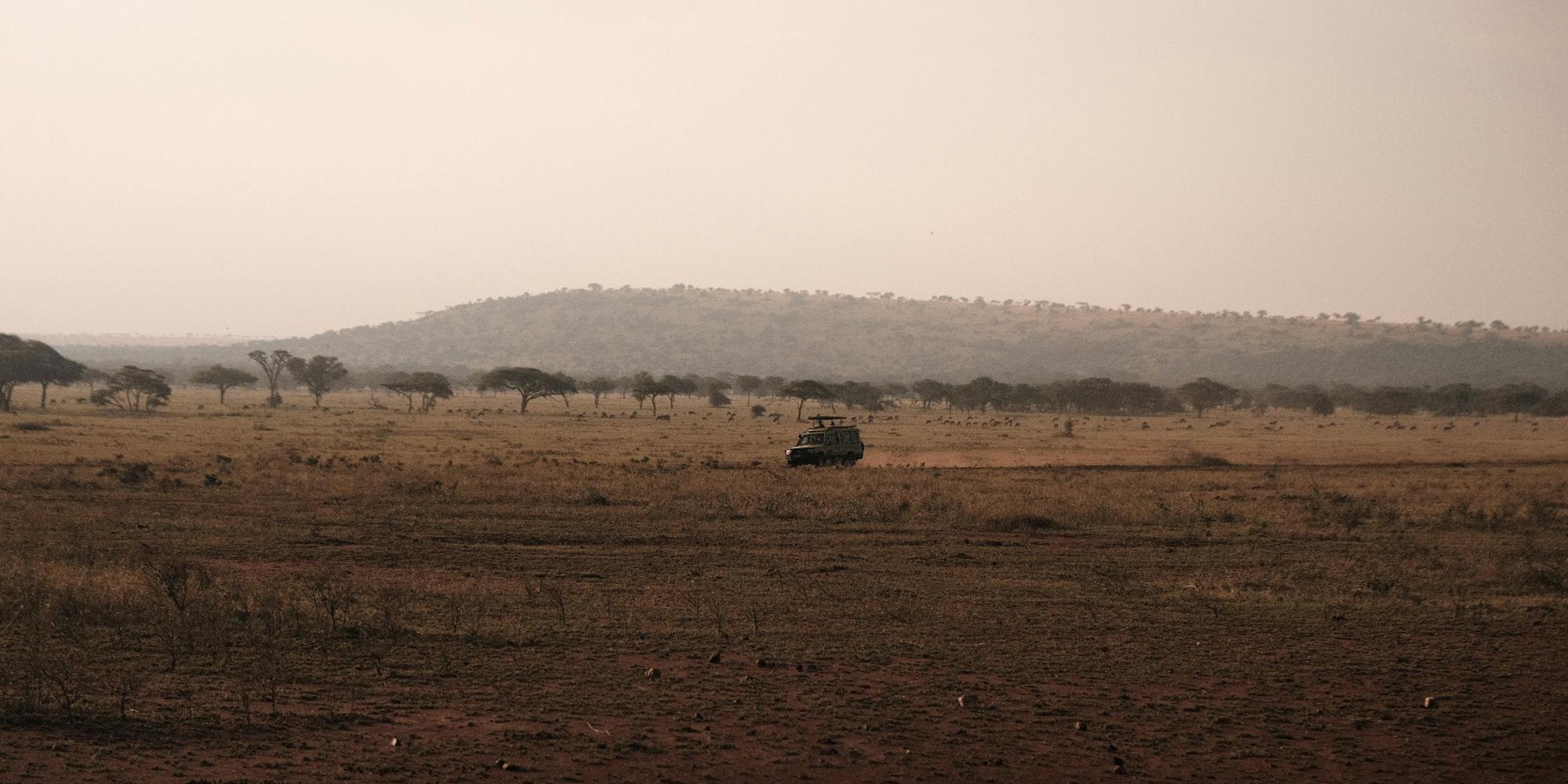 Safari vehicle in Tanzania savannah